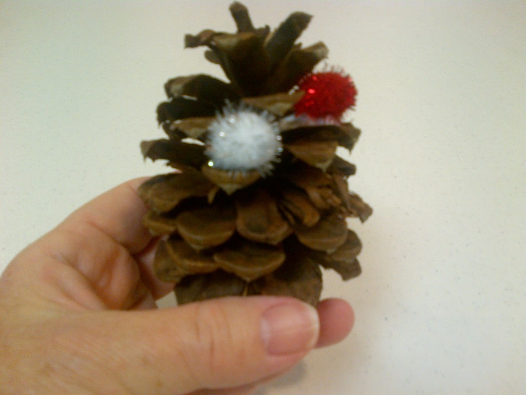 Pine cone with pompom on glue